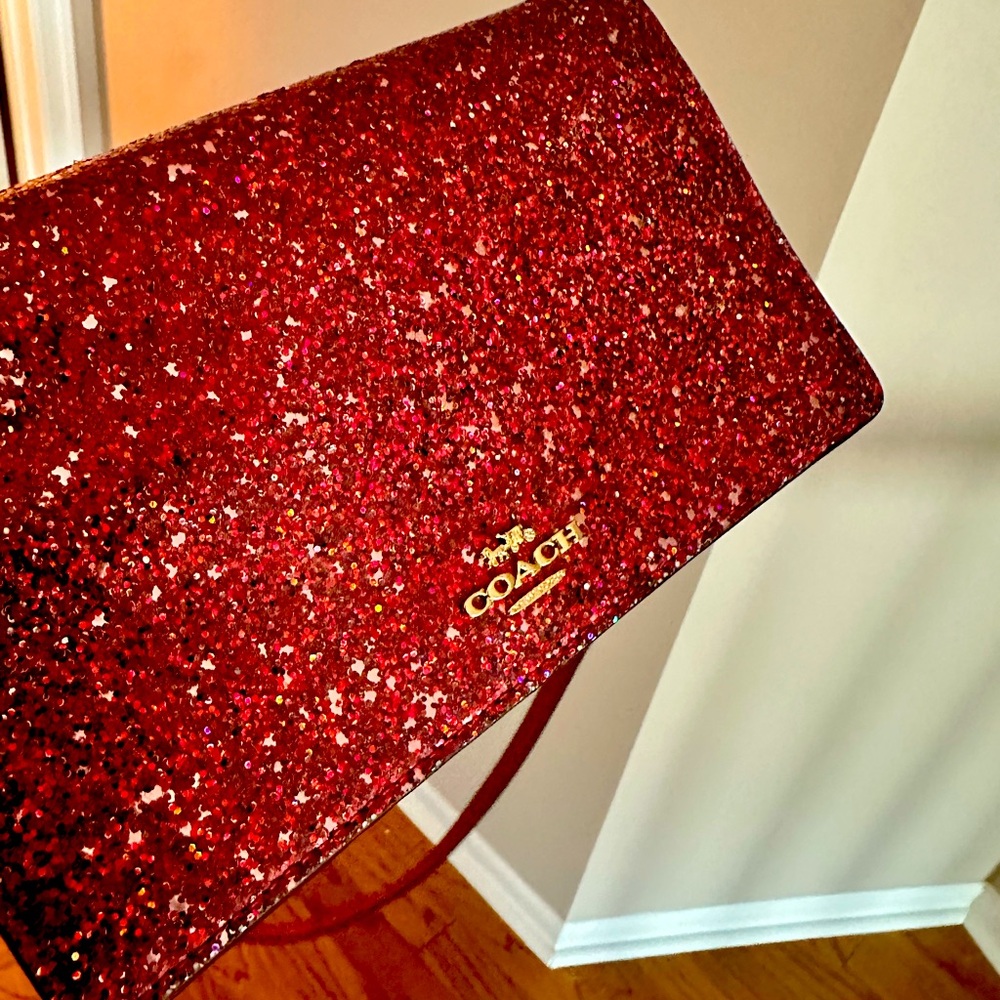 Coach glitter fold over clutch bag with ID card slots. Ruby and glittery.